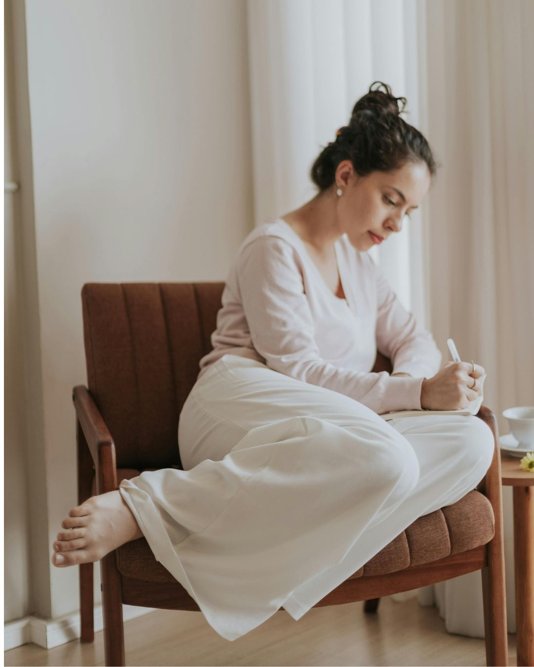 Cozy self-care space with journal and candle